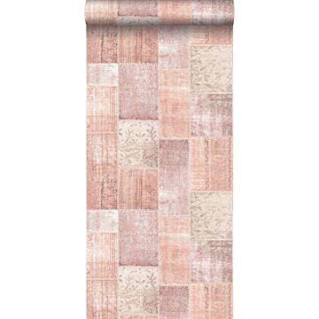 carta da parati tappeto kilim patchwork orientale in stilo Ibiza e Marrakech arancione rosa pesca